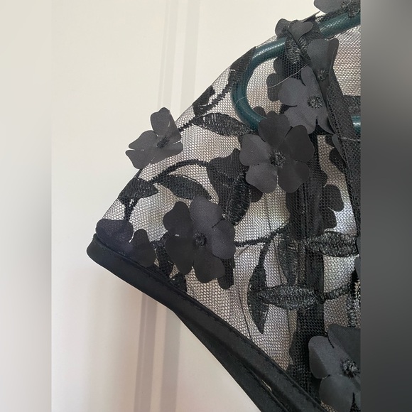 BHLDN nude gown with black mesh overlay, embroidery, and floral appliqué. - Picture 6 of 7